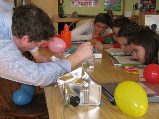 children in a classroom doing science experiments